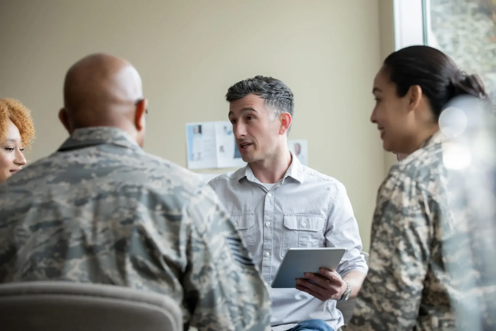 Group discussion with military personnel and leader.